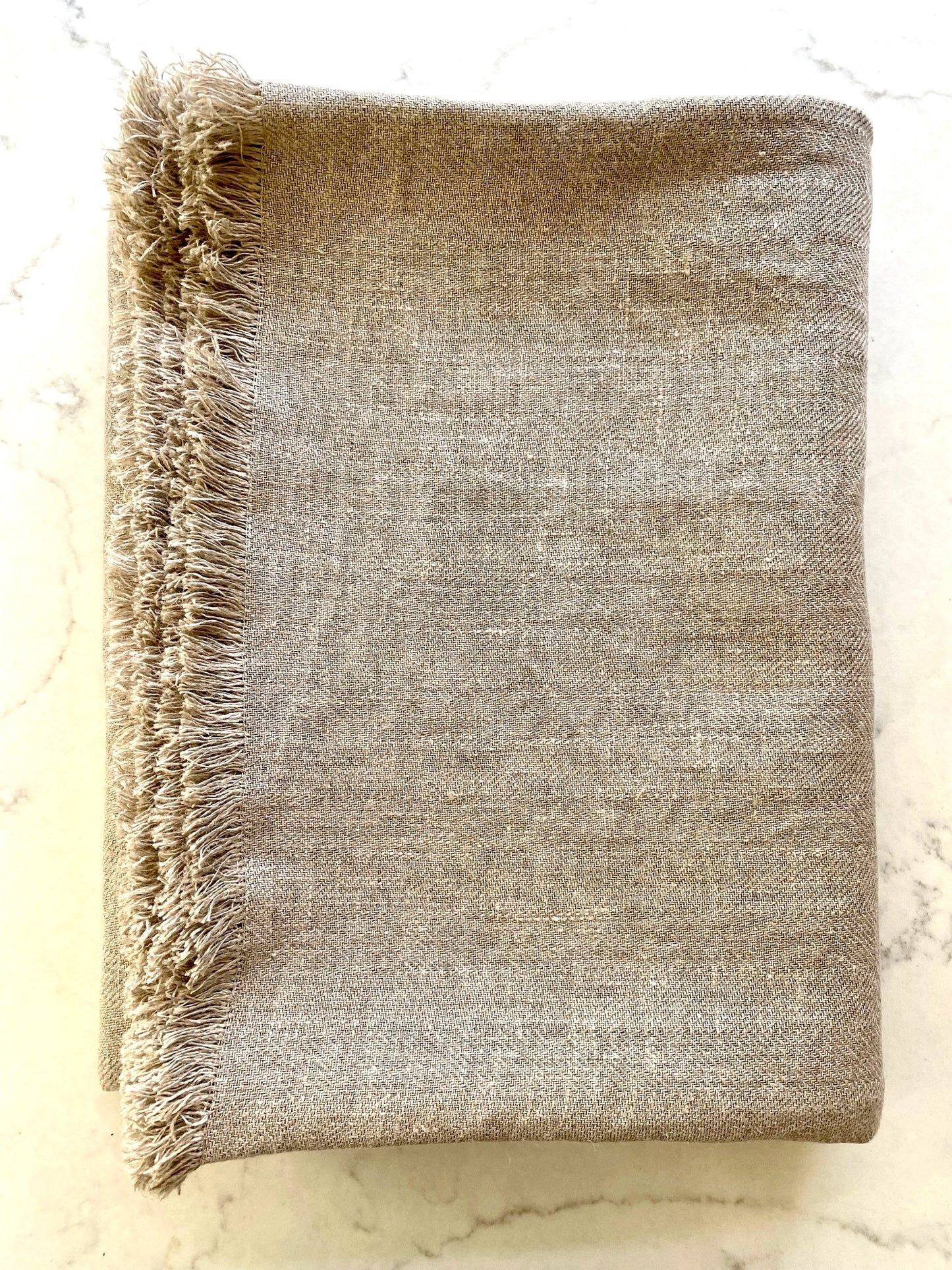 Linen throw blanket or tablecloth made from undyed natural linen